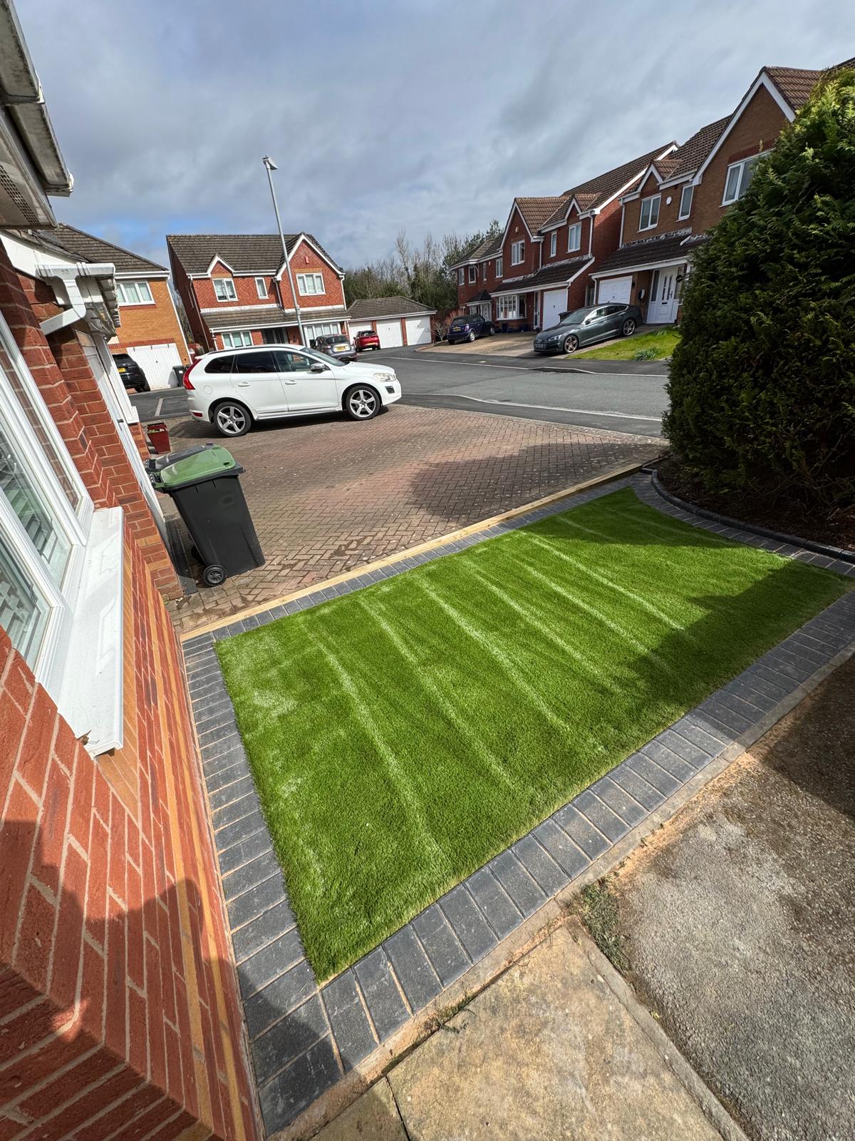 Driveway, artificial grass, dark blocked border