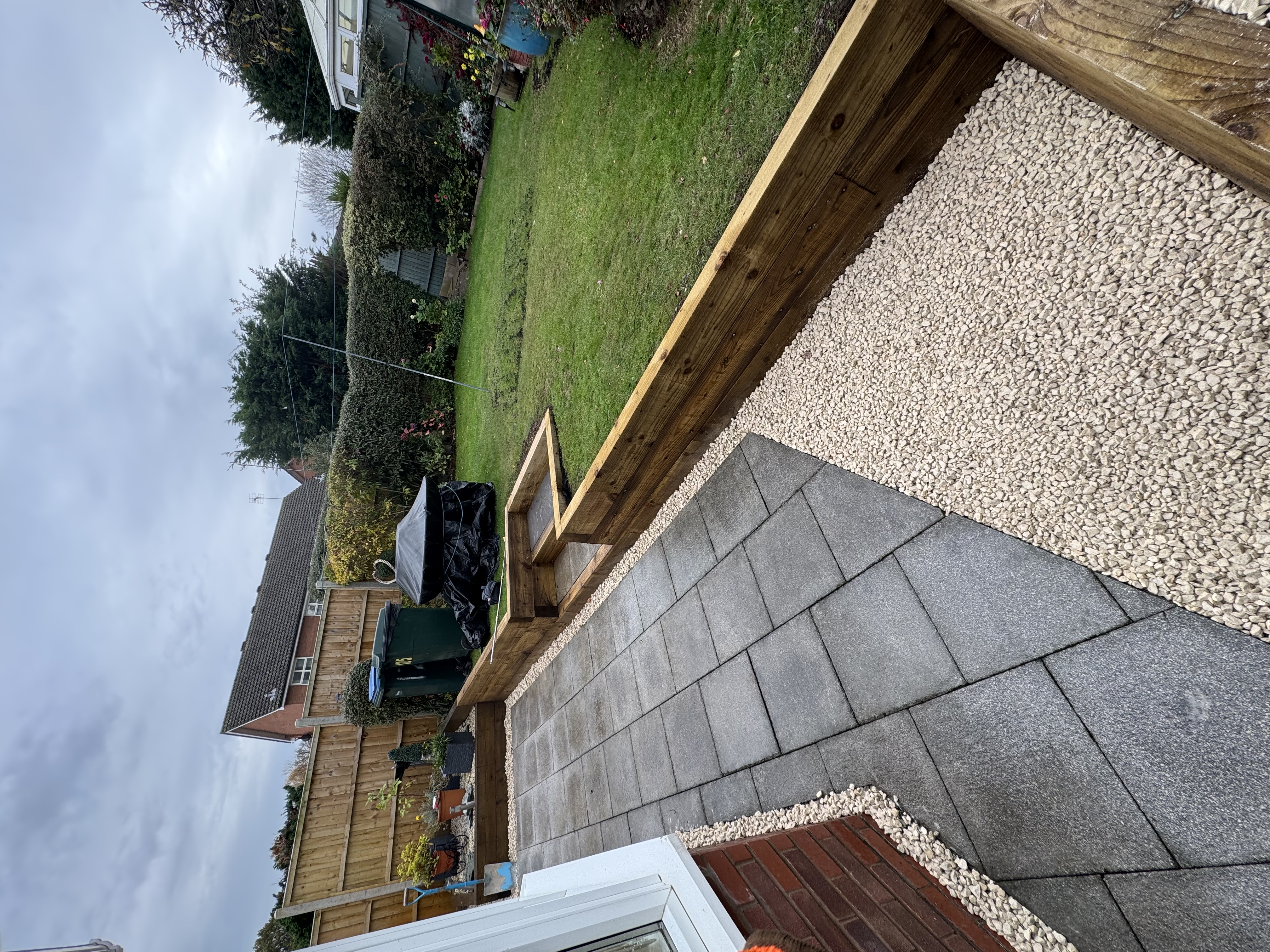 Patio, sleeper beds, turf and stone